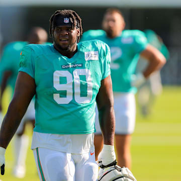Miami Dolphins defensive tackle Kenneth Grant (90) looks on from the field during training camp at Baptist Health Training Complex.