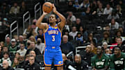 Oct 14, 2025; Milwaukee, Wisconsin, USA; Oklahoma City Thunder guard Chris Youngblood (3) hits a three point shot against the Milwaukee Bucks during the second half at Fiserv Forum. Mandatory Credit: Patrick Gorski-Imagn Images
