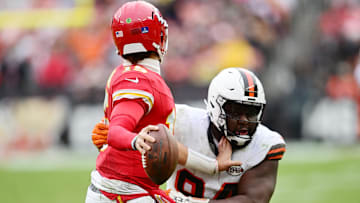 Dec 15, 2024; Cleveland, Ohio, USA; Cleveland Browns defensive tackle Dalvin Tomlinson (94) pressures Kansas City Chiefs quarterback Patrick Mahomes (15) during the second half at Huntington Bank Field. Mandatory Credit: Ken Blaze-Imagn Images