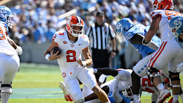 Oct 4, 2025; Chapel Hill, North Carolina, USA; Clemson Tigers quarterback Cade Klubnik (2) with the ball as North Carolina Tar Heels defensive lineman CJ Mims (92) defends in the second quarter at Kenan Stadium. Mandatory Credit: Bob Donnan-Imagn Images