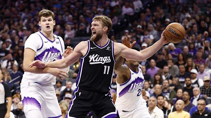 Oct 24, 2025; Sacramento, California, USA; Sacramento Kings center Domantas Sabonis (11) controls the ball against Utah Jazz center Walker Kessler (24) during the fourth quarter at Golden 1 Center. Mandatory Credit: Kelley L Cox-Imagn Images