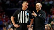Louisville Cardinals head coach Pat Kelsey talks to a referee during the first half of the game against the Creighton Bluejays in the first round of the NCAA Tournament at Rupp Arena. 