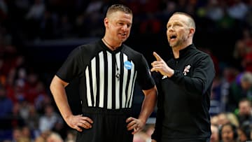 Louisville Cardinals head coach Pat Kelsey talks to a referee during the first half of the game against the Creighton Bluejays in the first round of the NCAA Tournament at Rupp Arena. 