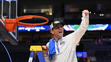 Mar 16, 2025; Nashville, TN, USA; Florida Gators head coach Todd Golden cuts the net after winning the 2025 SEC Championship Game at Bridgestone Arena. Mandatory Credit: Steve Roberts-Imagn Images