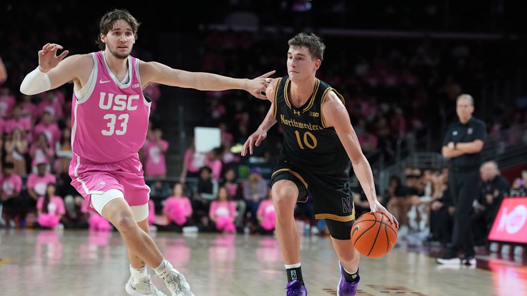 Jan 21, 2026; Los Angeles, California, USA; Northwestern Wildcats guard Max Green (10) dribbles the ball against Southern California Trojans forward Jaden Brownell (33) in the second half at Galen Center. Mandatory Credit: Kirby Lee-Imagn Images