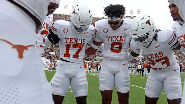 Oct 25, 2025; Starkville, Mississippi, USA; Texas Longhorns defensive backs Xavier Filsaime (17), Jonah Williams (9) and Jordon Johnson-Rubell (23) huddle up during warm ups prior to the game against the Mississippi State Bulldogs at Davis Wade Stadium at Scott Field. Mandatory Credit: Petre Thomas-Imagn Images