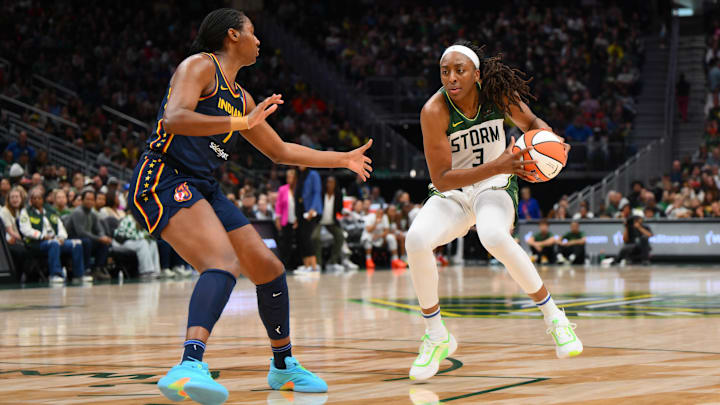 Aug 3, 2025; Seattle, Washington, USA; Seattle Storm forward Nneka Ogwumike (3) plays the ball while guarded by Indiana Fever forward Aliyah Boston (7) during the second half at Climate Pledge Arena. Mandatory Credit: Steven Bisig-Imagn Images