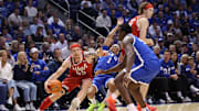 Mar 8, 2025; Provo, Utah, USA; Utah Utes guard Gabe Madsen (55) drives against Brigham Young Cougars guard Trey Stewart (1) during the second half at Marriott Center. Mandatory Credit: Rob Gray-Imagn Images