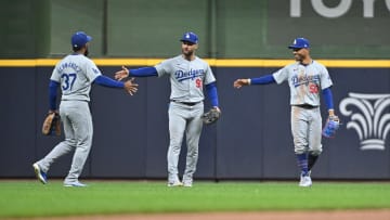 Aug 12, 2024; Milwaukee, Wisconsin, USA; Los Angeles Dodgers outfielder Teoscar Hernández (37), Los Angeles Dodgers outfielder Kevin Kiermaier (93) and Los Angeles Dodgers outfielder Mookie Betts (50) celebrate a 5-2 win over the Milwaukee Brewers at American Family Field. Mandatory Credit: Michael McLoone-USA TODAY Sports