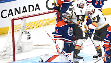 May 14, 2023; Edmonton, Alberta, CAN; Edmonton Oilers goalie Stuart Skinner (74) battes with Vegas Golden Knights centre   Nicolas Roy (10) and right winger Reilly Smith (19) in the first period in game six of the second round of the 2023 Stanley Cup Playoffs at Rogers Place. Mandatory Credit: Walter Tychnowicz-Imagn Images