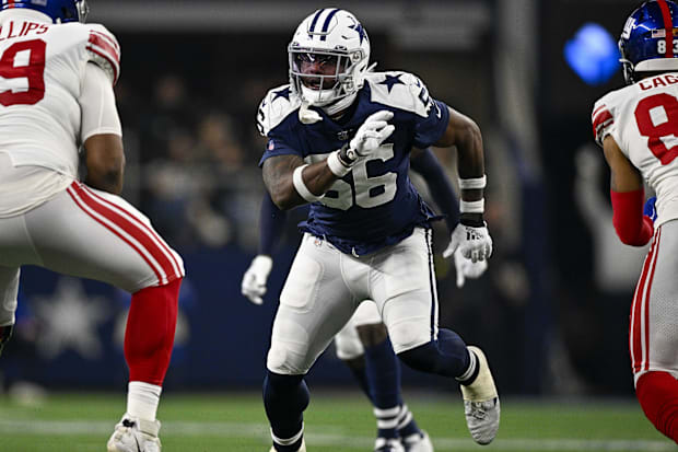 New York Giants guard Tyre Phillips and Dallas Cowboys defensive end Dante Fowler Jr. in action.