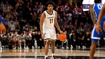 Jan 25, 2025; Nashville, Tennessee, USA;  Vanderbilt Commodores guard AJ Hoggard (11) dribbles the ball against the Kentucky Wildcats during the first half at Memorial Gymnasium. Mandatory Credit: Steve Roberts-Imagn Images