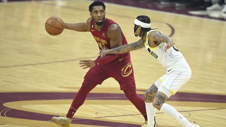 Dec 19, 2022; Cleveland, Ohio, USA; Utah Jazz guard Jordan Clarkson (00) defends Cleveland Cavaliers guard Donovan Mitchell (45) in the first quarter at Rocket Mortgage FieldHouse. Mandatory Credit: David Richard-USA TODAY Sports