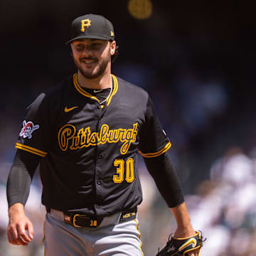 Jul 6, 2025; Seattle, Washington, USA; Pittsburgh Pirates starting pitcher Paul Skenes (30) smiles as he walks off the field during the third inning at T-Mobile Park. Mandatory Credit: Stephen Brashear-Imagn Images