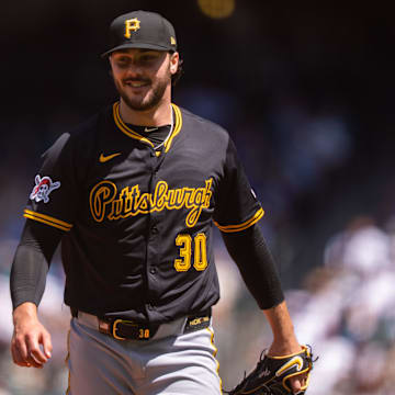 Jul 6, 2025; Seattle, Washington, USA; Pittsburgh Pirates starting pitcher Paul Skenes (30) smiles as he walks off the field during the third inning at T-Mobile Park. Mandatory Credit: Stephen Brashear-Imagn Images