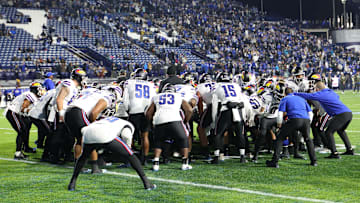 Nov 16, 2024; Provo, Utah, USA; The Kansas Jayhawks huddle before the game against the Brigham Young Cougars at LaVell Edwards Stadium. Mandatory Credit: Rob Gray-Imagn Images