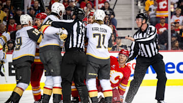 Apr 5, 2025; Calgary, Alberta, CAN; Calgary Flames center Blake Coleman (20) reacts after being taken down to the ice by the Vegas Golden Knights during the second period at Scotiabank Saddledome. Mandatory Credit: Brett Holmes-Imagn Images