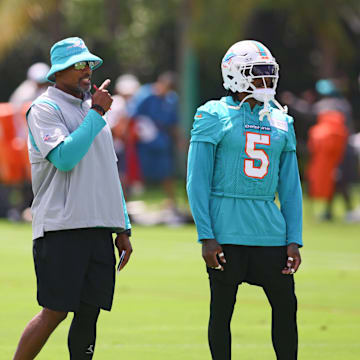 Miami Dolphins defensive coordinator Anthony Weaver talks to cornerback Jalen Ramsey (5) during mandatory minicamp at Baptist Health Training Complex.