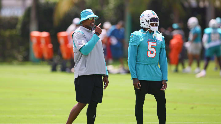 Jun 4, 2024; Miami Gardens, FL, USA; Miami Dolphins defensive coordinator Anthony Weaver talks to cornerback Jalen Ramsey (5) during mandatory minicamp at Baptist Health Training Complex. Mandatory Credit: Sam Navarro-USA TODAY Sports