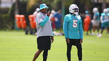 Jun 4, 2024; Miami Gardens, FL, USA; Miami Dolphins defensive coordinator Anthony Weaver talks to cornerback Jalen Ramsey (5) during mandatory minicamp at Baptist Health Training Complex. Mandatory Credit: Sam Navarro-Imagn Images
