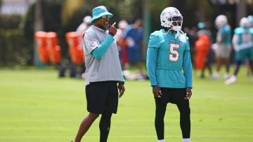 Jun 4, 2024; Miami Gardens, FL, USA; Miami Dolphins defensive coordinator Anthony Weaver talks to cornerback Jalen Ramsey (5) during mandatory minicamp at Baptist Health Training Complex.