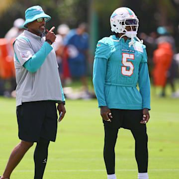 Miami Dolphins defensive coordinator Anthony Weaver talks to cornerback Jalen Ramsey (5) during mandatory minicamp at Baptist Health Training Complex.