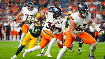 Aug 18, 2024; Denver, Colorado, USA; Denver Broncos running back Tyler Badie (36) runs for a touchdown in the fourth quarter against the Green Bay Packers  at Empower Field at Mile High. Mandatory Credit: Ron Chenoy-USA TODAY Sports