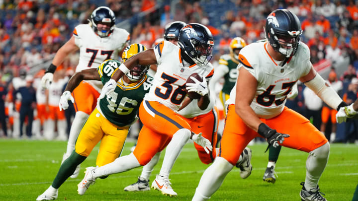 Aug 18, 2024; Denver, Colorado, USA; Denver Broncos running back Tyler Badie (36) runs for a touchdown in the fourth quarter against the Green Bay Packers  at Empower Field at Mile High. Mandatory Credit: Ron Chenoy-USA TODAY Sports