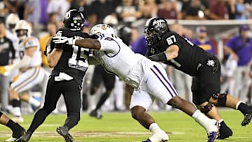 Oct 26, 2024; College Station, Texas, USA; LSU Tigers defensive tackle Jay'viar Suggs (31) applies pressure to Texas A&M Aggies quarterback Conner Weigman (15) during the third quarter. The Aggies defeated the Tigers 38-23; at Kyle Field. Mandatory Credit: Maria Lysaker-Imagn Images.