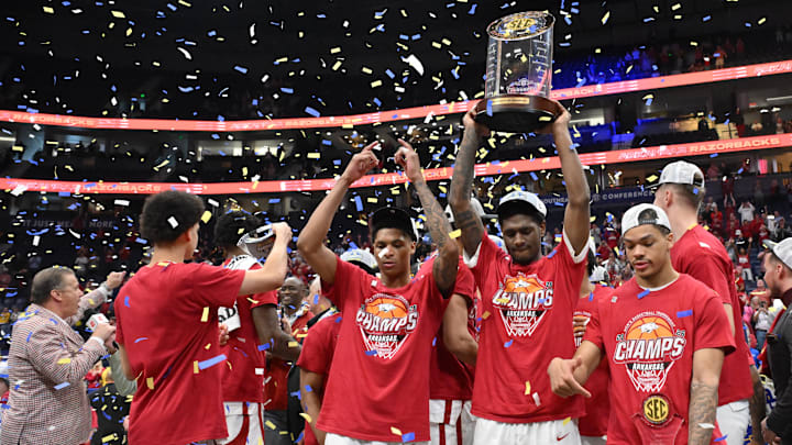 Mar 15, 2026; Nashville, TN, USA; The Arkansas Razorbacks celebrate with the trophy after the men's SEC Conference Tournament Championship against the Vanderbilt Commodores at Bridgestone Arena. Mandatory Credit: Steve Roberts-Imagn Images