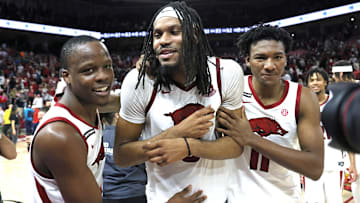  Arkansas Razorbacks guard Johnell Davis (1) celebrates with forwards Jonas Aidoo (9) and Karter Knox (11) after the game against the Mississippi State Bulldogs at Bud Walton Arena. Arkansas won 93-92. 