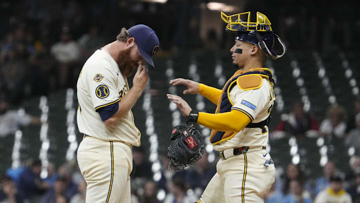 Aug 25, 2025; Milwaukee, Wisconsin, USA; Milwaukee Brewers pitcher Brandon Woodruff (53) is visibly upset after giving up a home run as catcher William Contreras (24) goes to the mound during the sixth inning against the Arizona Diamondbacks at American Family Field. Mandatory Credit: Michael McLoone-Imagn Images