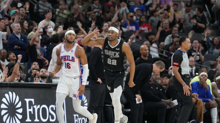 Apr 7, 2024; San Antonio, Texas, USA;  San Antonio Spurs guard Malaki Branham (22) reacts to a shot in front of Philadelphia 76ers guard Ricky Council IV (16) in overtime at Frost Bank Center. Mandatory Credit: Daniel Dunn-USA TODAY Sports