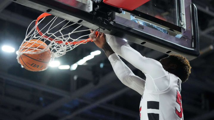 Cincinnati Bearcats forward Aziz Bandaogo (55) dunks in the first half of a college basketball game against the San Francisco Dons in the National Invitational Tournament, Wednesday, March 20, 2024, at Fifth Third Arena in Cincinnati.