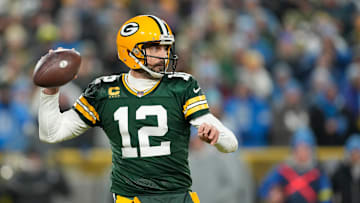 Aaron Rodgers throws a pass during a 2022 NFL matchup between the Green Bay Packers and Detroit Lions