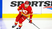 Sep 23, 2024; Calgary, Alberta, CAN; Calgary Flames center Yegor Sharangovich (17) skates during the warmup period against the Edmonton Oilers at Scotiabank Saddledome. Mandatory Credit: Sergei Belski-Imagn Images