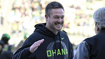 Nov 22, 2025; Eugene, Oregon, USA; Oregon Ducks head coach Dan Lanning smiles before the game against the Southern California Trojans at Autzen Stadium. Mandatory Credit: Troy Wayrynen-Imagn Images