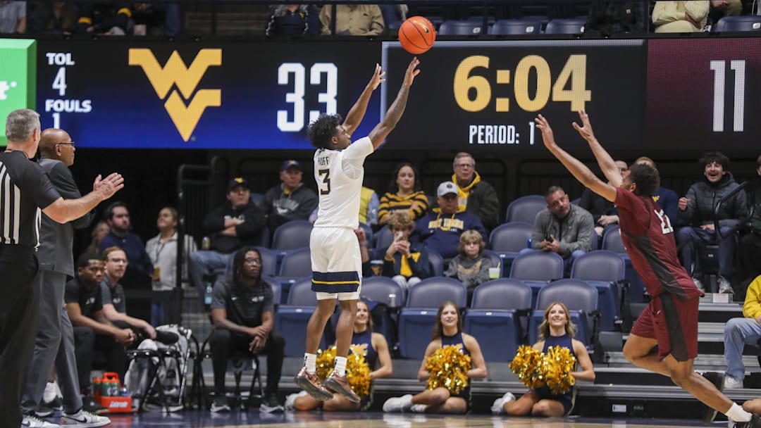 Dec 9, 2025; Morgantown, West Virginia, USA; West Virginia Mountaineers guard Honor Huff (3) shoots a three pointer during the first half against the Little Rock Trojans at Hope Coliseum. Dec 9, 2025; Morgantown, West Virginia, USA; West Virginia Mountaineers guard Honor Huff (3) shoots a three pointer during the first half against the Little Rock Trojans at Hope Coliseum.