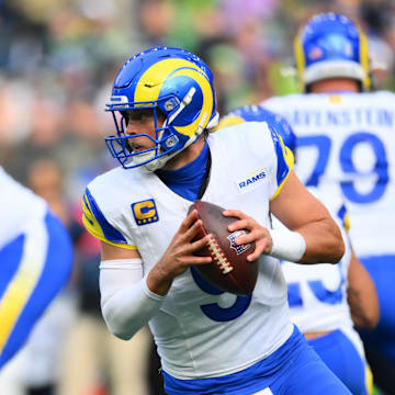 Nov 3, 2024; Seattle, Washington, USA; Los Angeles Rams quarterback Matthew Stafford (9) looks to pass the ball against the Seattle Seahawks during the first half at Lumen Field. Mandatory Credit: Steven Bisig-Imagn Images