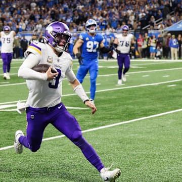 Nov 2, 2025; Detroit, Michigan, USA; Minnesota Vikings quarterback J.J. McCarthy (9) runs the ball for a touchdown in the third quarter against the Detroit Lions at Ford Field.
