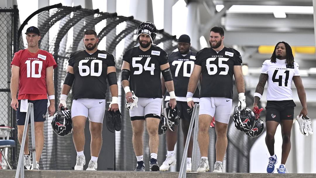 Jun 9, 2026; Houston, Texas, USA; Houston Texans guard Jarrett Patterson, center, Houston Texans center Jake Andrews, left center, Houston Texans quarterback Davis Mills left, Houston Texans center Eli Cox, right center and Houston Texans cornerback Stephen Hall, right, arrive for the team’s minicamp at Houston Methodist Training Center. Mandatory Credit: Maria Lysaker-Imagn Images 