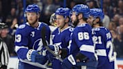 Feb 6, 2025; Tampa, Florida, USA; Tampa Bay Lightning center Jake Guentzel (59) is congratulated by defenseman Darren Raddysh (43), right wing Nikita Kucherov (86) and center Brayden Point (21) after scoring against the Ottawa Senators during the first period at Amalie Arena. Mandatory Credit: Kim Klement Neitzel-Imagn Images