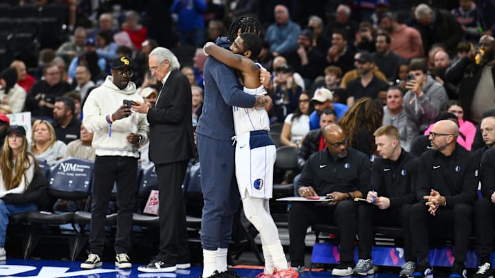 Dallas Mavericks forward Davis and guard Irving embrace before the game against the Philadelphia 76ers at Wells Fargo Center. 
