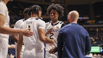Dec 3, 2025; Morgantown, West Virginia, USA; West Virginia Mountaineers guard Amir Jenkins (2) celebrates with West Virginia Mountaineers guard Jasper Floyd (1) during the second half against the Coppin State Eagles at Hope Coliseum. Mandatory Credit: Ben Queen-Imagn Images