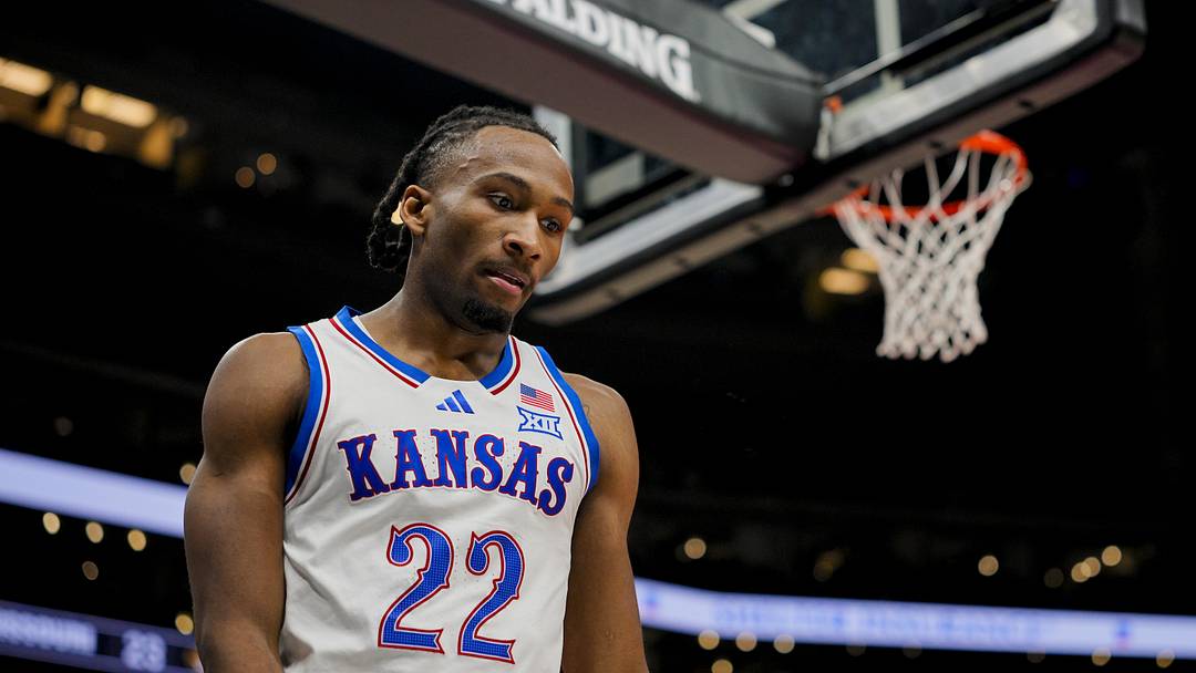 Dec 7, 2025; Kansas City, Missouri, USA; Kansas Jayhawks guard Darryn Peterson (22) reacts during the first half against the Missouri Tigers at T-Mobile Center. Mandatory Credit: Jay Biggerstaff-Imagn Images