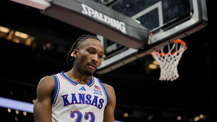 Dec 7, 2025; Kansas City, Missouri, USA; Kansas Jayhawks guard Darryn Peterson (22) reacts during the first half against the Missouri Tigers at T-Mobile Center. Mandatory Credit: Jay Biggerstaff-Imagn Images