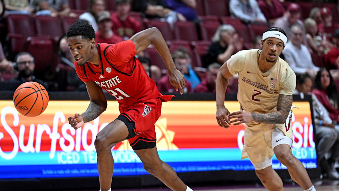 Jan 10, 2026; Tallahassee, Florida, USA; Florida State Seminoles guard Cam Miles (2) loses the ball as North Carolina State Wolfpack guard Terrance Arceneaux (21) picks it up during the second half at Donald L. Tucker Center. Mandatory Credit: Melina Myers-Imagn Images