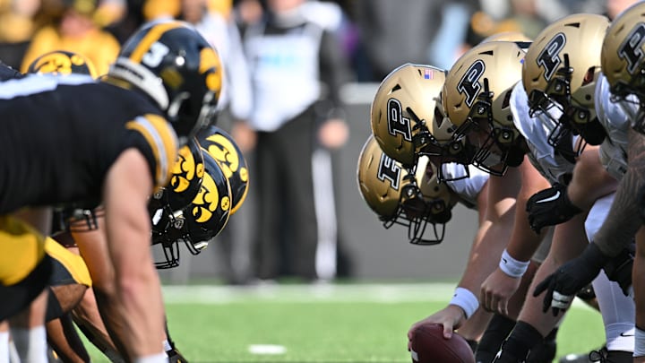 The line of scrimmage between the Iowa Hawkeyes and the Purdue Boilermakers The line of scrimmage between the Iowa Hawkeyes and the Purdue Boilermakers