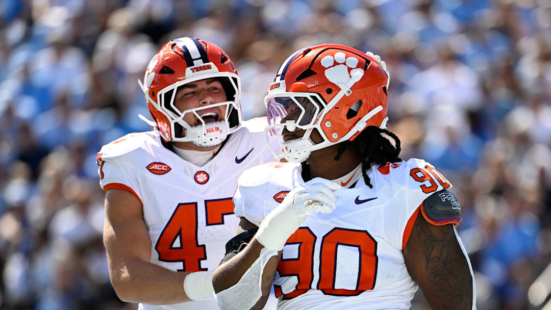 Oct 4, 2025; Chapel Hill, North Carolina, USA;  Clemson Tigers defensive tackle Stephiylan Green (90) reacts with linebacker Sammy Brown (47) in the second quarter at Kenan Stadium. Mandatory Credit: Bob Donnan-Imagn Images