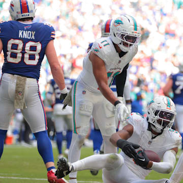 Miami Dolphins safety Ifeatu Melifonwu (9) celebrates with safety Dante Trader Jr. (11) and safety Minkah Fitzpatrick (29) after an interception against Buffalo Bills tight end Dawson Knox (88) during the second half at Hard Rock Stadium. 